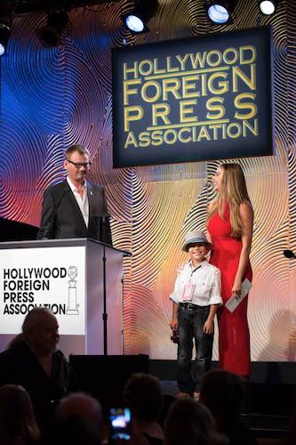 Pablove Shutterbug Jacob on stage with Sofia Vergara and Theo Kingma.