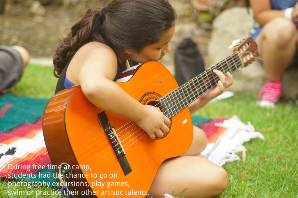 Pablove Shutterbugs Alumni Camp girl playing guitar