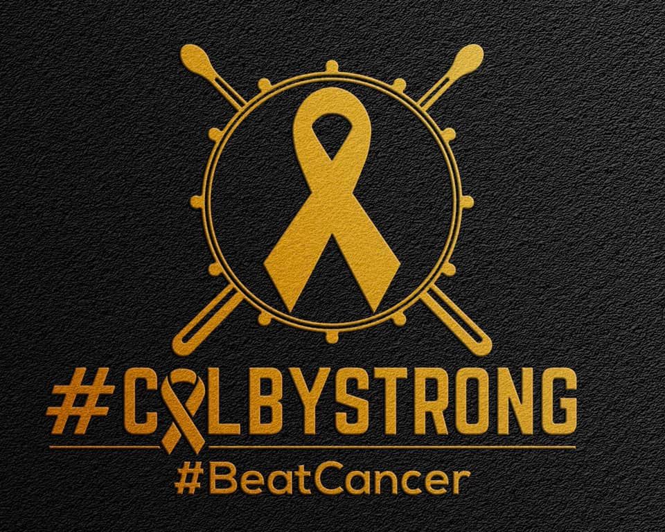 illustration of gold ribbon on top of a drum with hashtags #colbystrong #beatcancer
