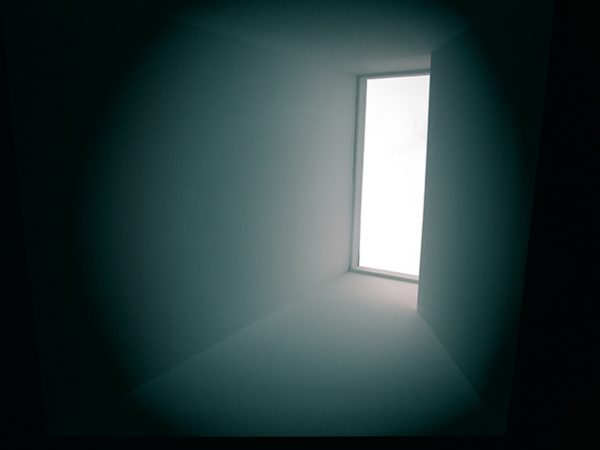 shaft of light coming through a window creating a graphic atmosphere in a blue room